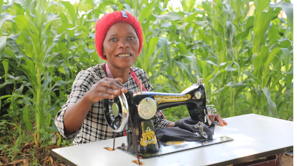 Asiyatu uses her tailoring skills to earn an income and provide for her family. ©UNFPA/Joseph Scott/2025