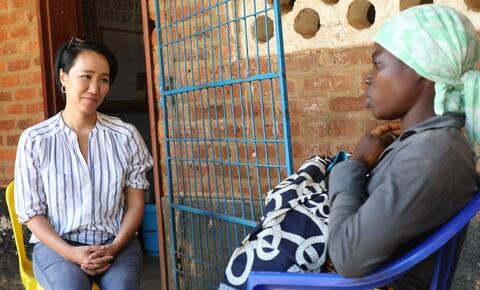 Won Young talks to a woman who had just given birth at Namitoso Camp in Machinga district