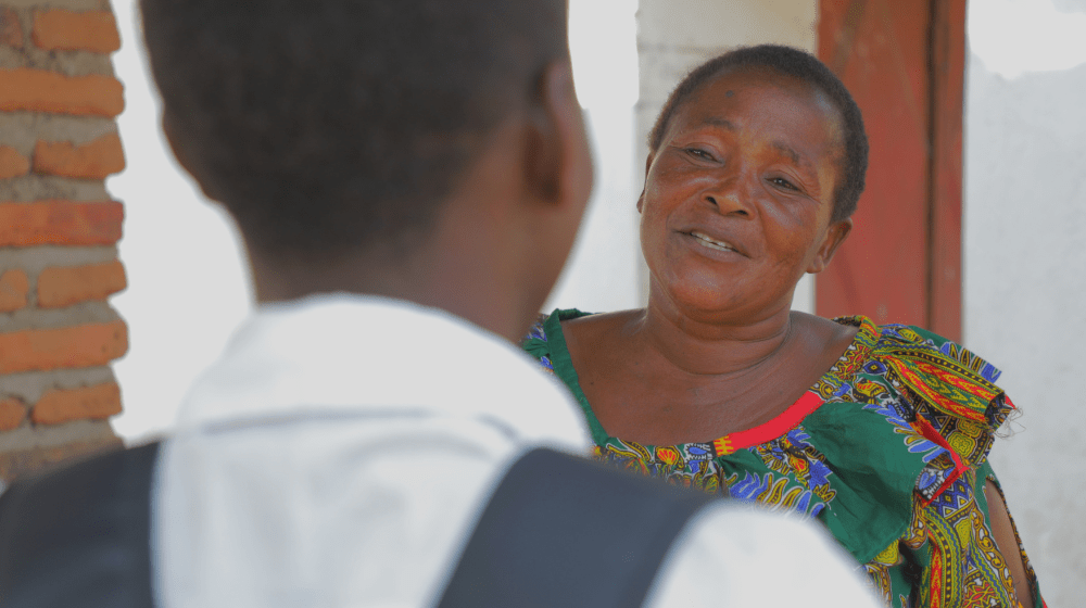 Ms. Fundi has been a pillar of support in Linda's journey back from early marriage. ©UNFPA/2024/Joseph Scott