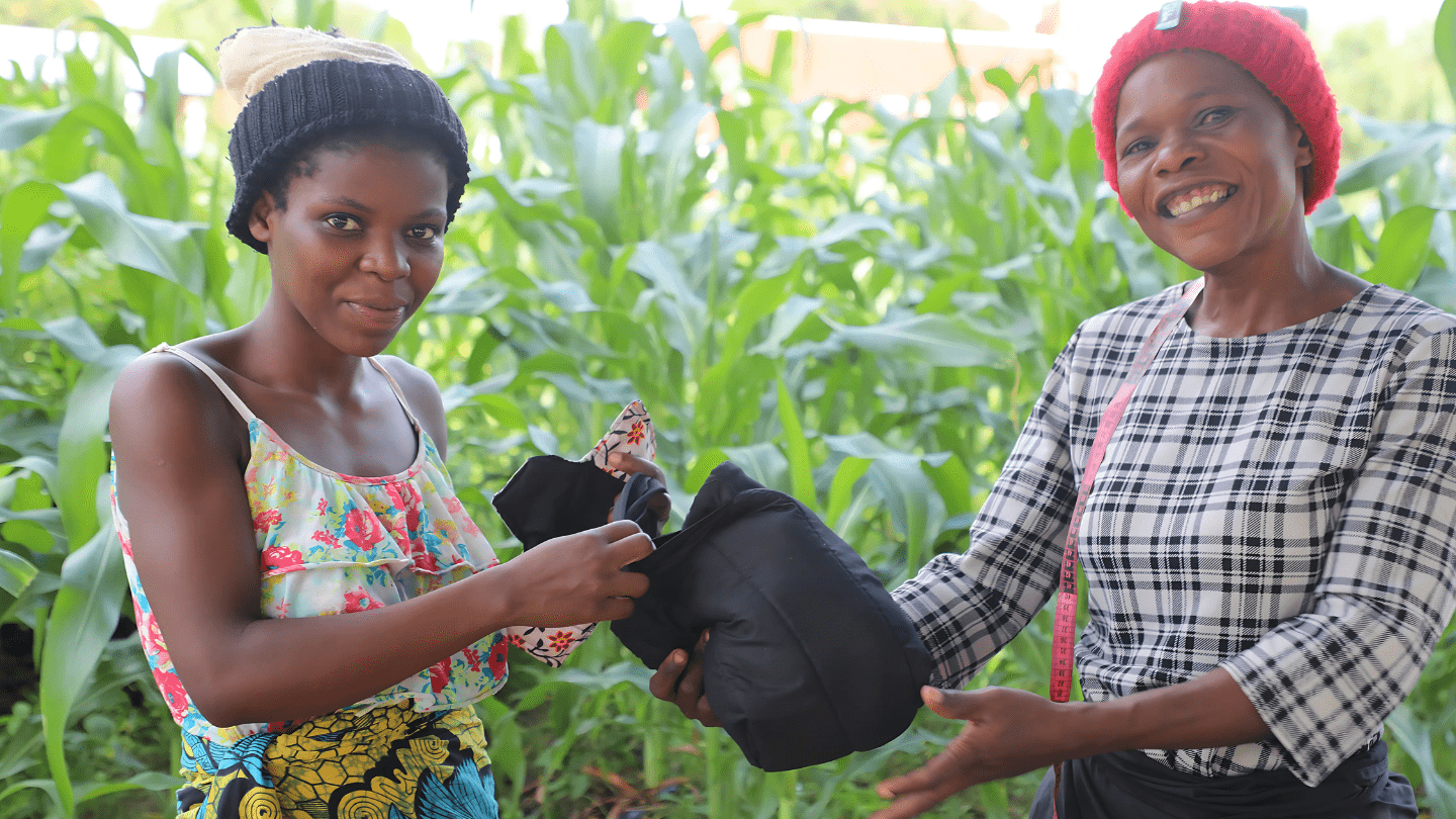 Thanks to support from UNFPA, Asiyatu (right) received sewing equipment and training in tailoring as part of the social reintegration programme ©UNFPA/Joseph Scott/2025