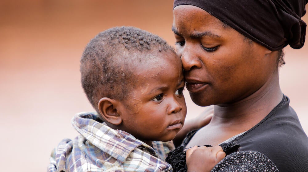 Edith Goliyati, 32, with her 11-month-old son. 