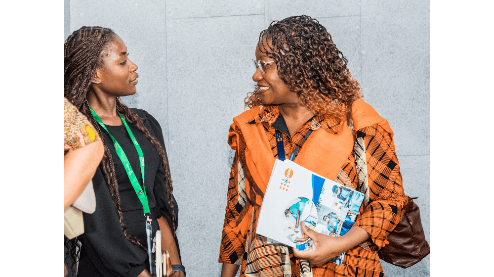 Ms. Zigomo interacting with a youth leader on the sidelines of the 9th African Population Conference in Lilongwe ©UNFPA/Malawi