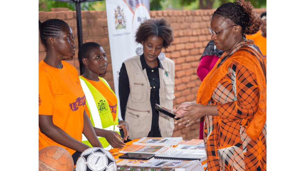 Ms. Zigomo appreciating a digital platforms used at a safe space for girls in Lilongwe ©UNFPA/Malawi